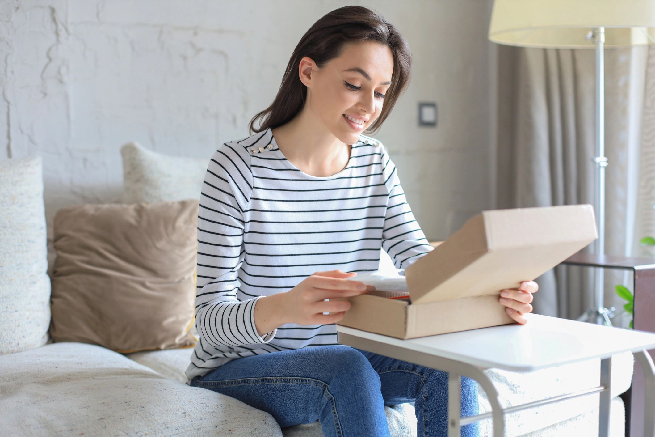 Customer unboxing a package at home