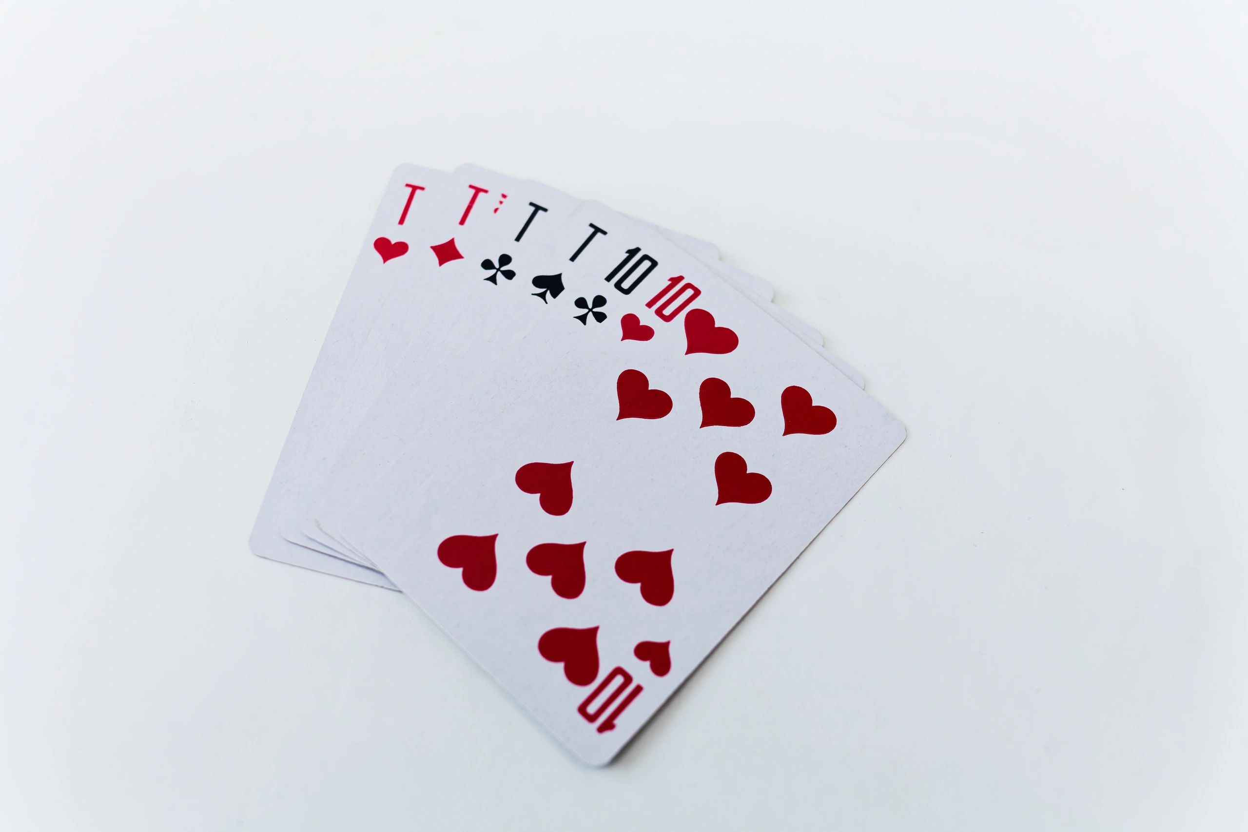 Fanned playing cards on a white background, representing card enthusiasm